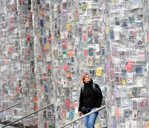 Student standing in front of abstract art piece