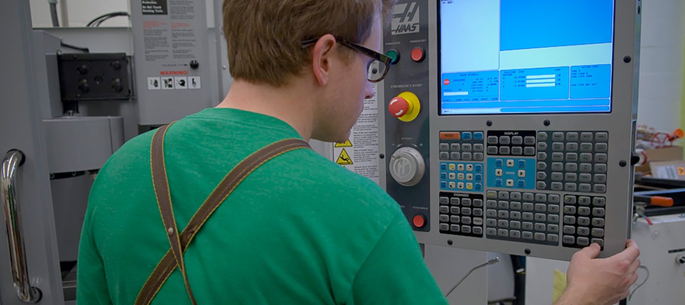 Person at CNC machine