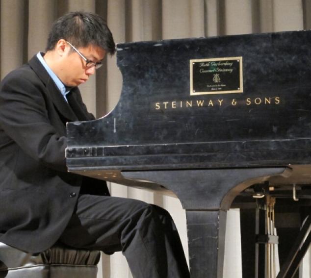 Graduate piano student Andrew Chen performs in Brechemin Auditorium.