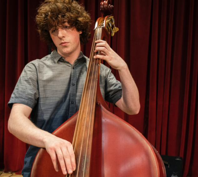 Student bassist (Photo: Mark Stone, UW Photography).